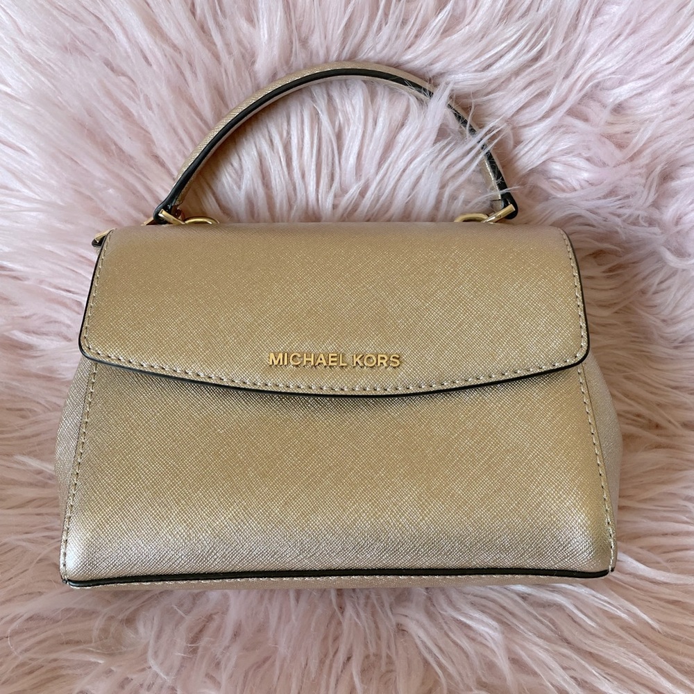 Adorable Michael Kors rose gold small, structured top handle bag